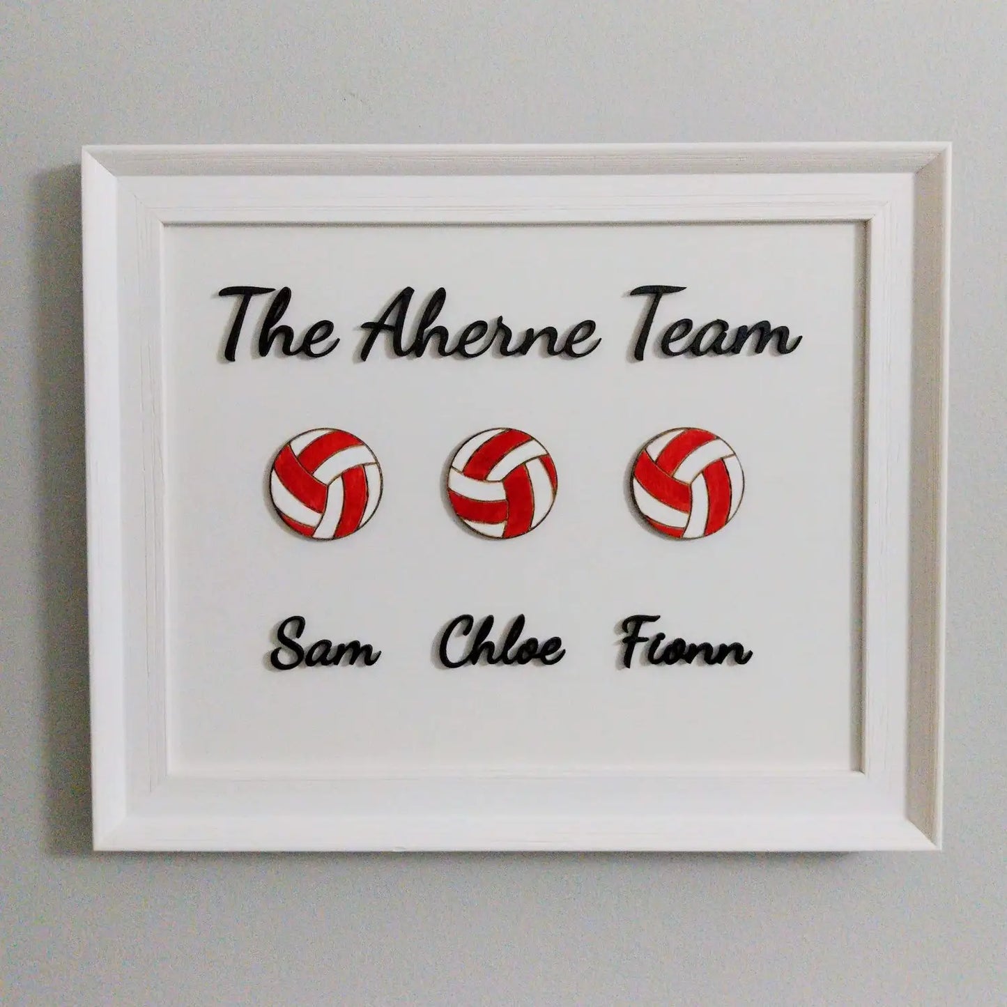 a framed football family artwork