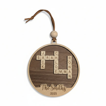 Wooden ornament with crossword-style name design with surname and year engraved
