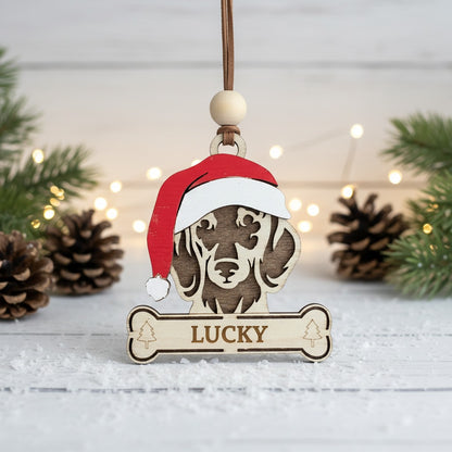 Wooden ornament of Dachshund dog wearing a Santa hat