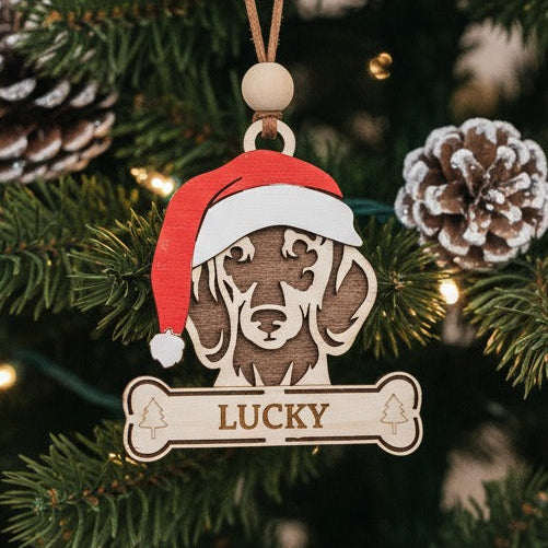 Christmas tree ornament of dachshund wearing a hand painted santa hat
