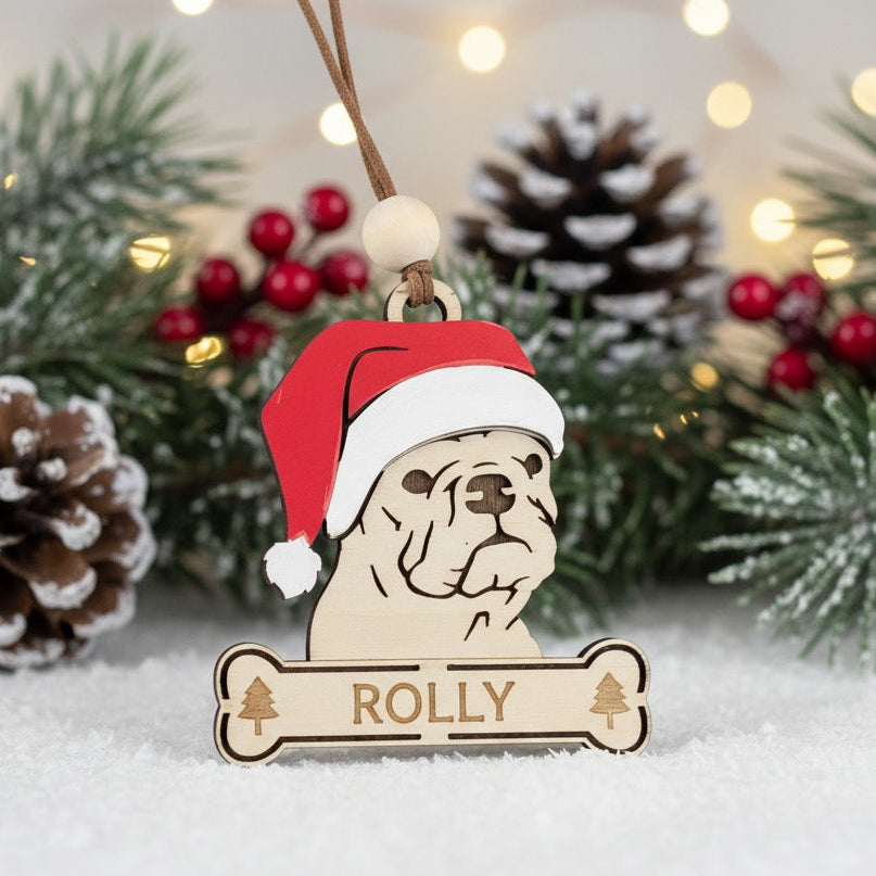 Wooden Christmas themed ornament of French Bulldog wearing a Santa hat 