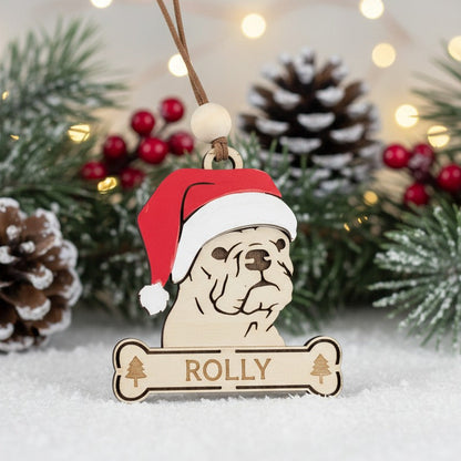 Wooden Christmas themed ornament of French Bulldog wearing a Santa hat 
