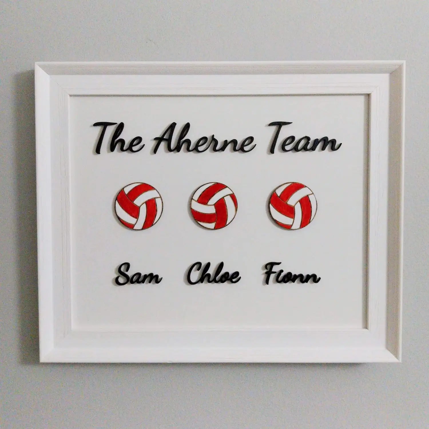 a framed football family artwork
