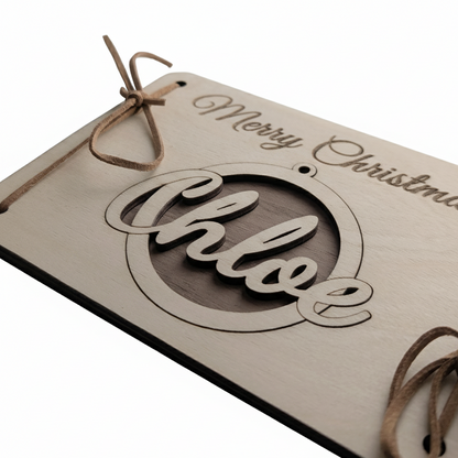 Wooden Christmas card with Merry Christmas text and a removable personalised bauble