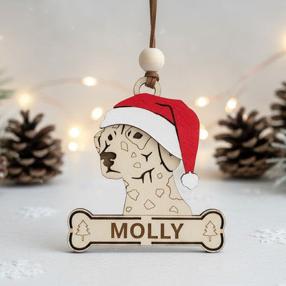 Wooden dalmatian dog ornament wearing a Santa hat