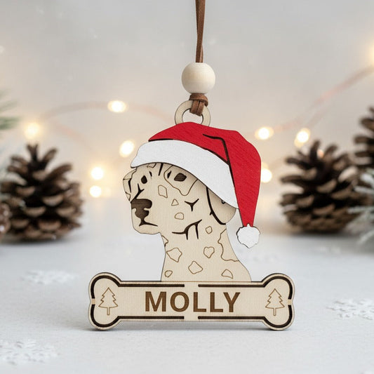 Wooden dalmatian dog ornament wearing a Santa hat
